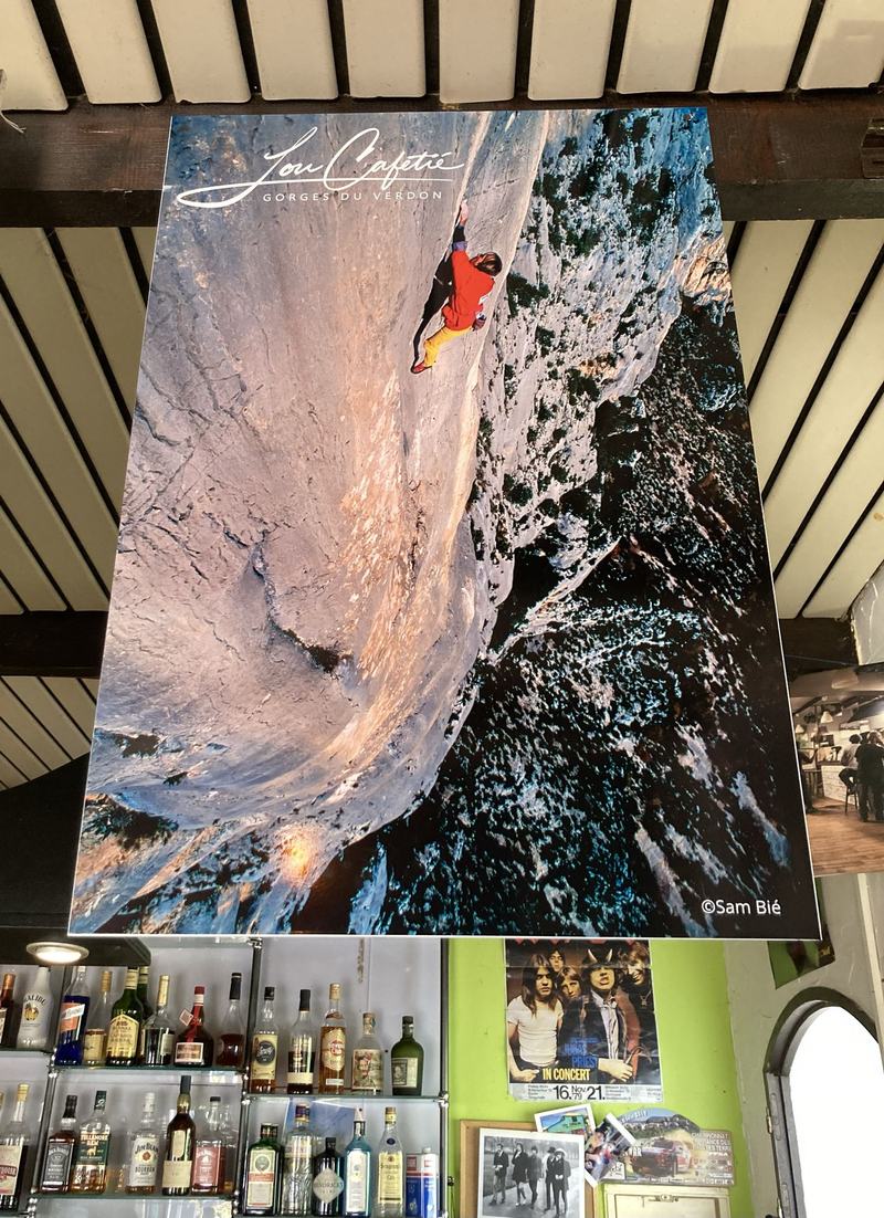 The poster on the bar ceiling, above the bottles and a concert bill from 1979