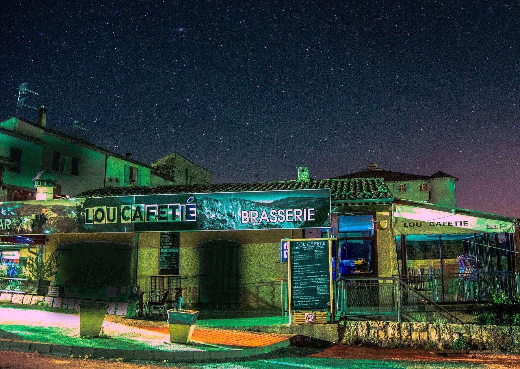 The front of Lou Cafetié in La Palud-sur-Verdon at night, under a starry sky